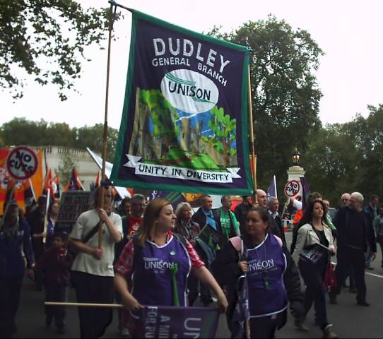 Marchers in UNISON tabards with giant banner