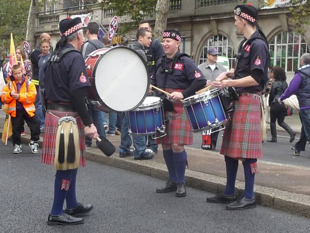 A drum group performing in kilt and sporran